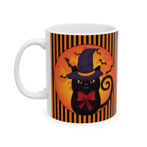 Halloween mug with black cat wearing a purple pointed had and a red bow around neck in side a circle with bats flying behind on an orange and black stripe background with a white handle ton the left