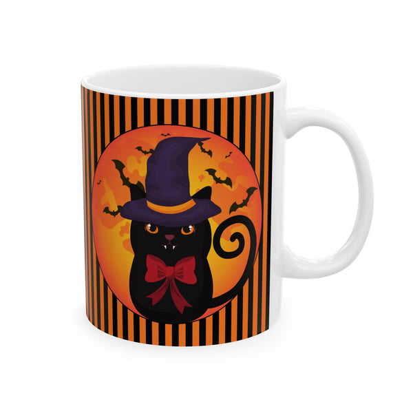 Halloween mug with black cat wearing a purple pointed had and a red bow around neck in side a circle with bats flying behind on an orange and black stripe background with a white handle on the right