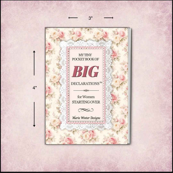 A small pocket book with a floral cover design and lace border, shown on a pale pink textured background with dimension arrows indicating 3 by 4 inches. The cover reads “My Tiny Pocket Book of Big Declarations for Women Starting Over” by Marie Winter Designs.