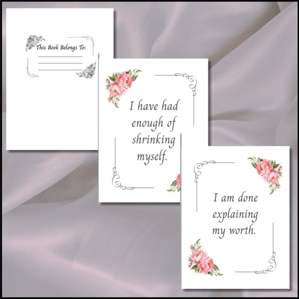 Three white printed cards with floral corner designs and inspirational text, arranged on a soft lavender satin fabric background.