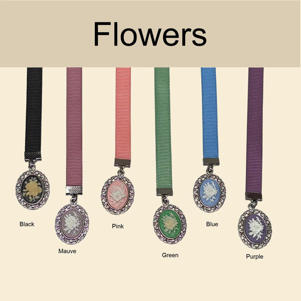 Victorian style ribbon bookmarks with floral cameo charms displayed in multiple colors including black, mauve, pink, green, blue, and purple, labeled “Flowers,” elegant vintage bookmark collection for readers