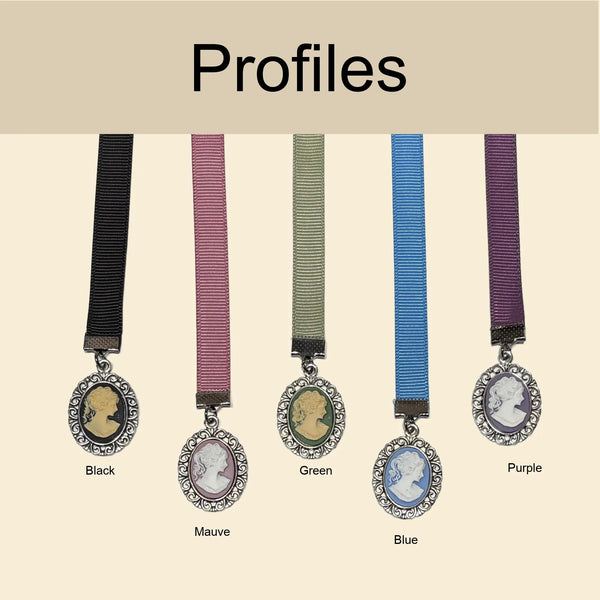Five Victorian style ribbon bookmarks with cameo charms displayed in color options: black, mauve, green, blue, and purple, labeled “Profiles,” elegant vintage bookmark collection for book lovers
