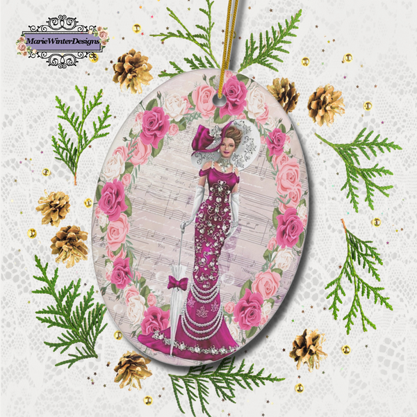 oval Oval ceramic ornament with Edwardian Lady with large hat music sheet background surrounded with pink and white roses laying on lace surrounded with gold pine cones and greenery