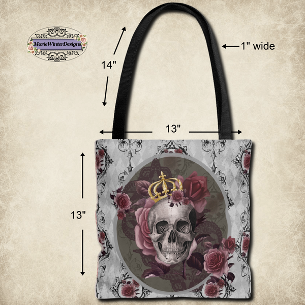 Measurements of Tote bag with black handle and design of a gray skull with gold crown and roses on a gray background with back scroll lines and burgundy flowers.