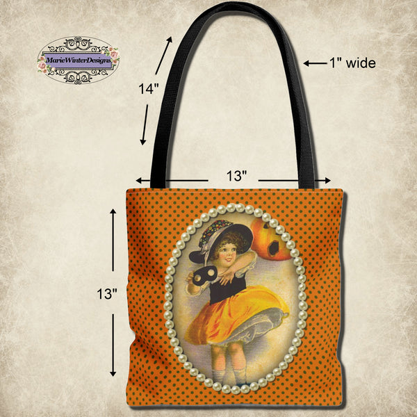 Measurements of Vintage-inspired Halloween tote bag featuring an illustration of a young girl in a witch costume, framed with pearls on a polka dot orange background. 13" x 13", 14" x 1" strap