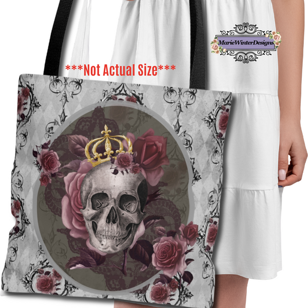 Person carrying a Tote bag with black handle and design of a gray skull with gold crown and roses on a gray background with back scroll lines and burgundy flowers.