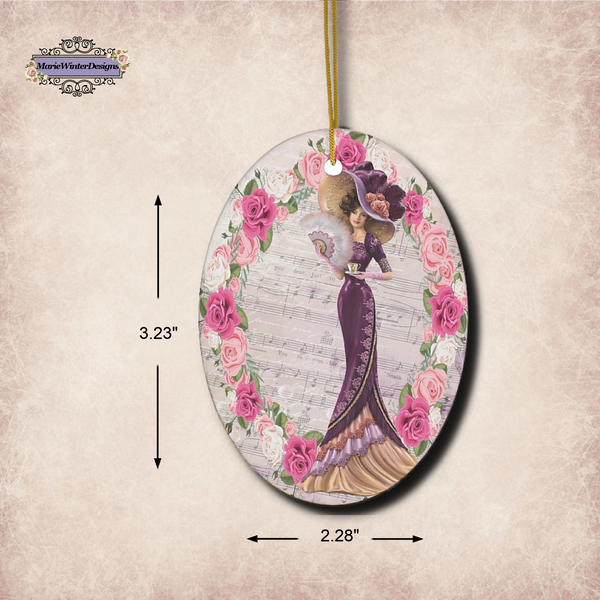 Measurements 3.23" x 2.28' of Oval ceramic ornament with Edwardian Lady with large hat music sheet background surrounded with pink and white roses 
