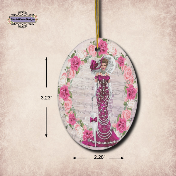 Measurements 3.23" x 2.28" of oval Oval ceramic ornament with Edwardian Lady with large hat music sheet background surrounded with pink and white roses