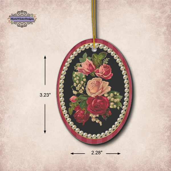 Measurements of oval ceramic ornament Vintage Floral Cameo Design with red and pink flowers against black background surrounded with a fame of cream pearls
