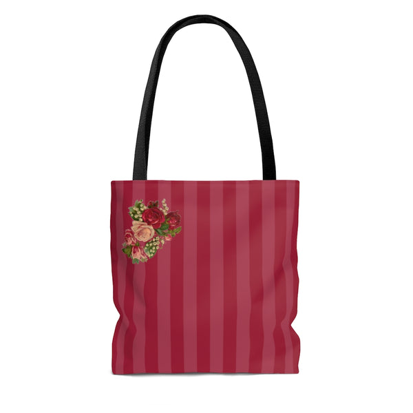 back side of red stripe tote bag with black handles and cluster of flowers