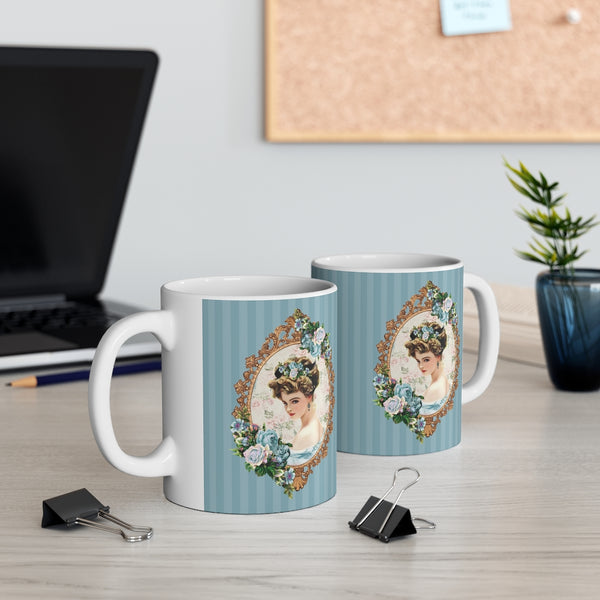 front and back view of Ceramic Mug with With Elegant Early 1900s Vintage Harrison Fisher Illustration of Lady In Gold Frame On Blue Striped Background with white handle