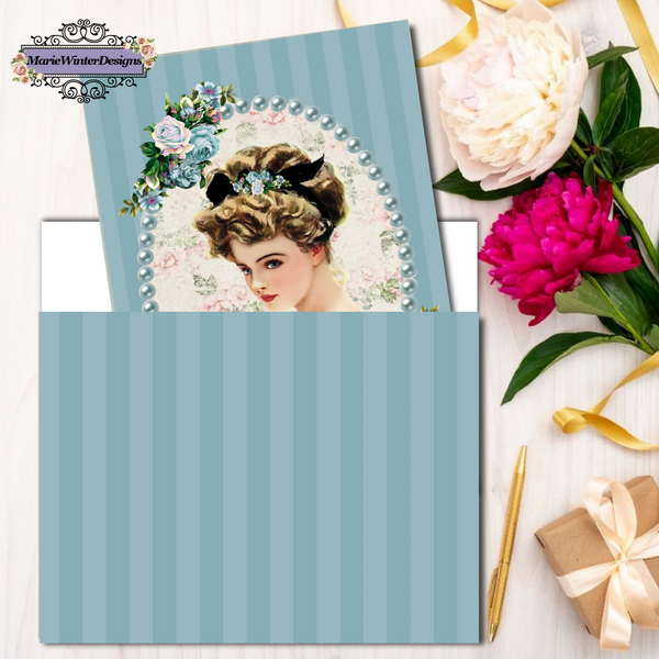 Greeting Card with Elegant Early 1900s Vintage Harrison Fisher Illustration of Lady surrounded by ble pearls, 2 clusters of blue flowers on blue stipe background in blue stripe envelope