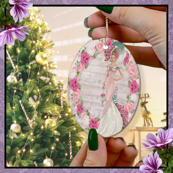 Hands with green nail polish holding an oval Oval ceramic ornament with Edwardian Lady with large hat music sheet background surrounded with pink and white roses with Christmas tree in background.