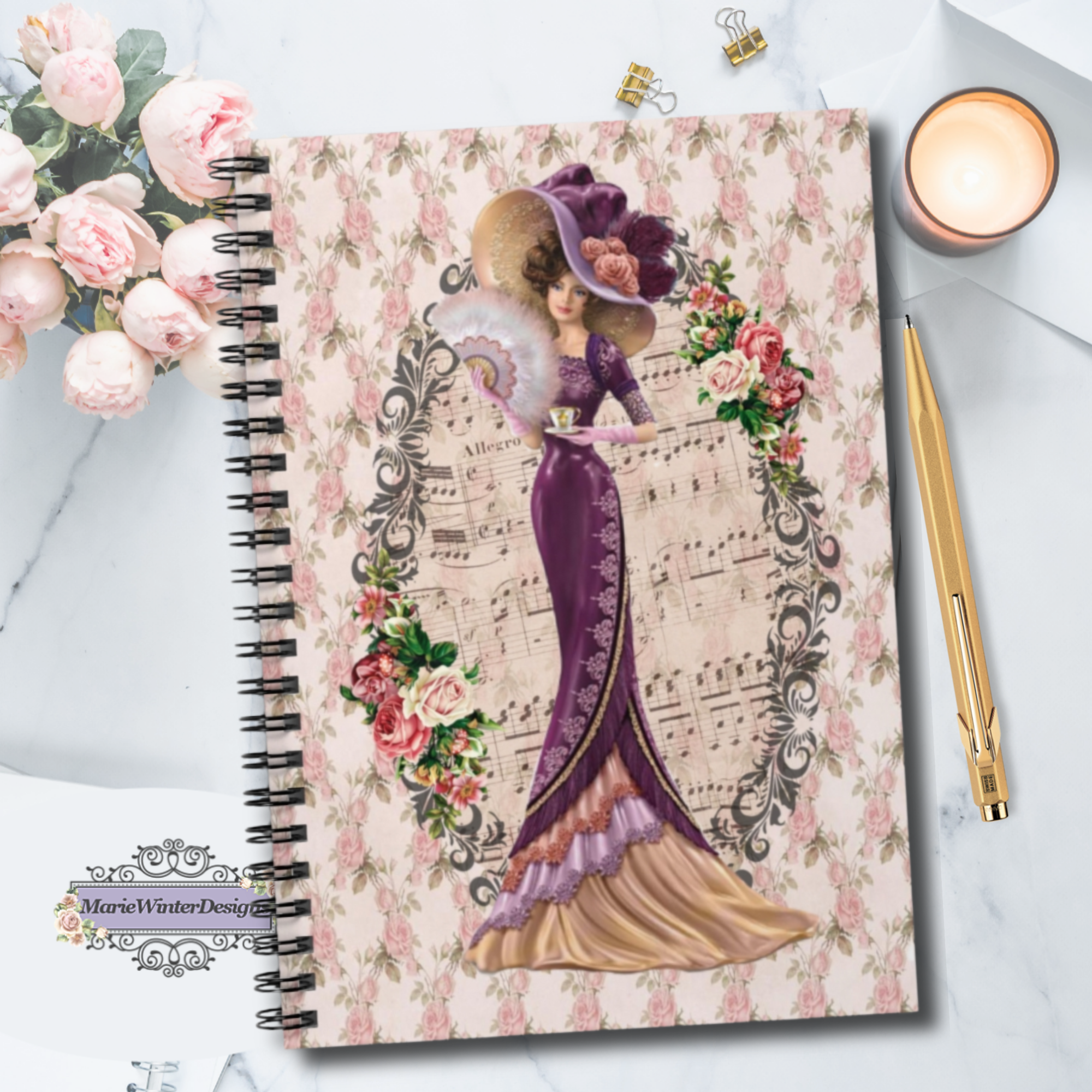 Spiral Bound Notebook Journal Lined Pages with Early 1900s Vintage Hello Dolly Lady in a Burgandy Dress and Large Hat on a Floral Background with pen, candle pink roses behind