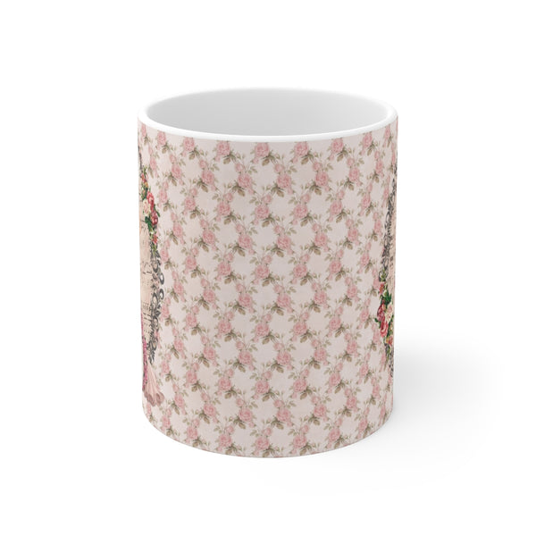 side view of mug with pink roses green leaf pattern on white