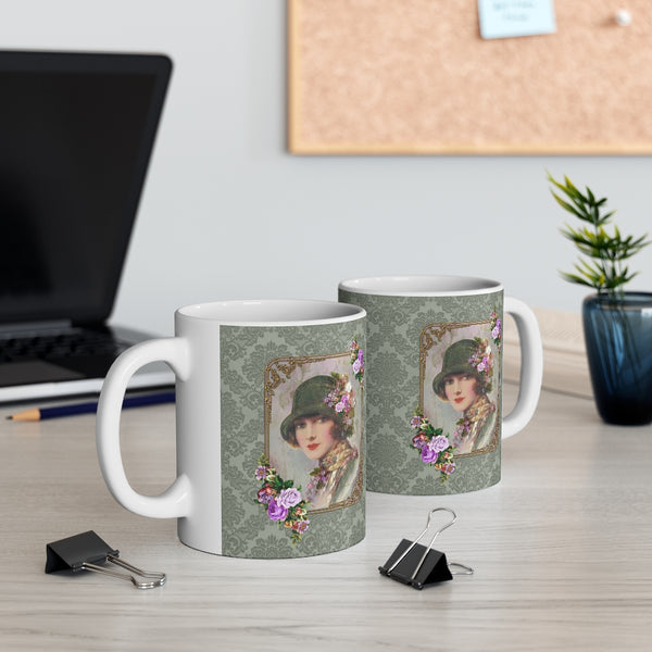 front and back view of Ceramic Mug With Elegant  1920s Vintage Woman in Green Flapper Style Gatsby Hat with purple flowers on green damask background with white handle 