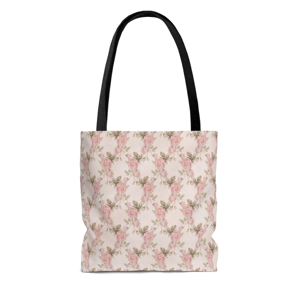 tote bag with pink roses with green leaves over white background with black handles